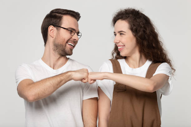 What Does It Mean When a Guy Fist Bumps a Girl?